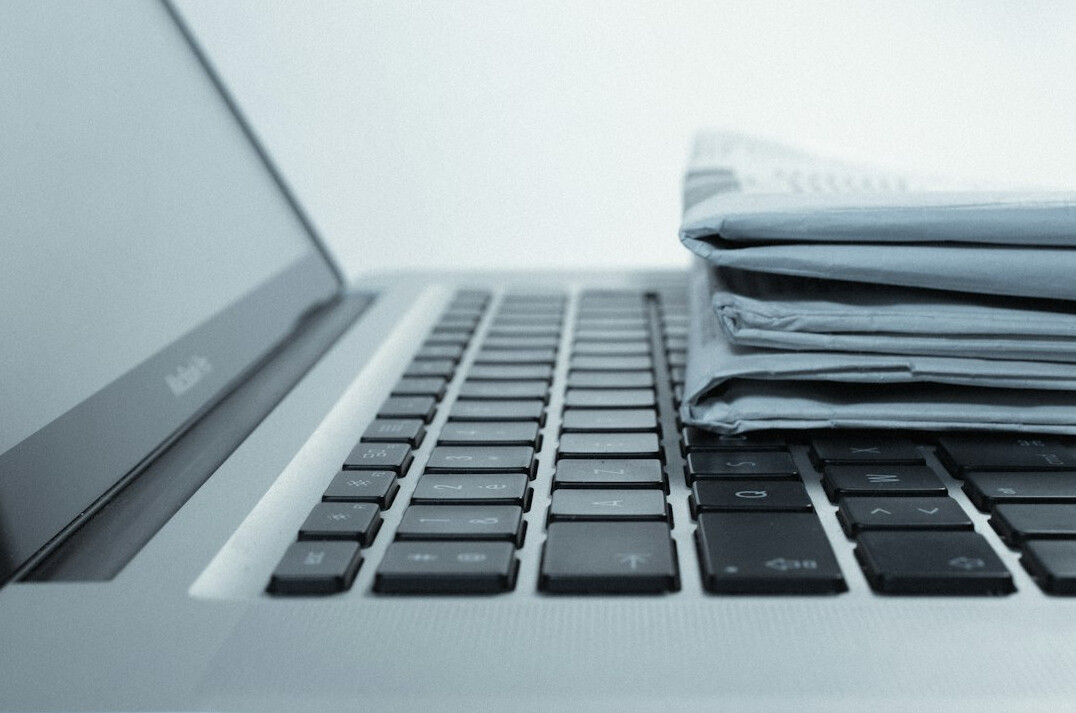 Hands typing on a laptop filling out an online insurance form