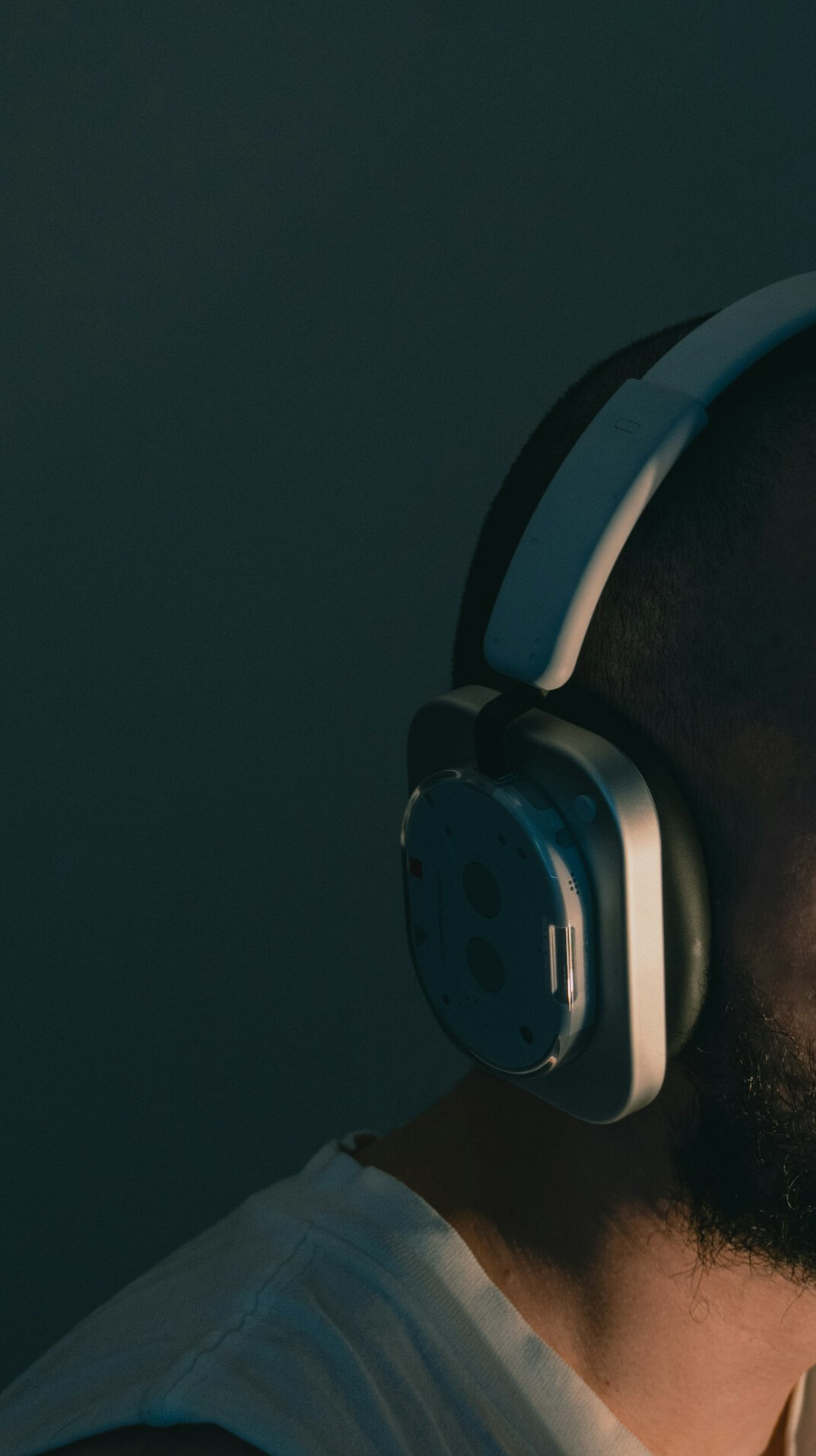 Friendly customer support agent wearing a headset smiling at desk