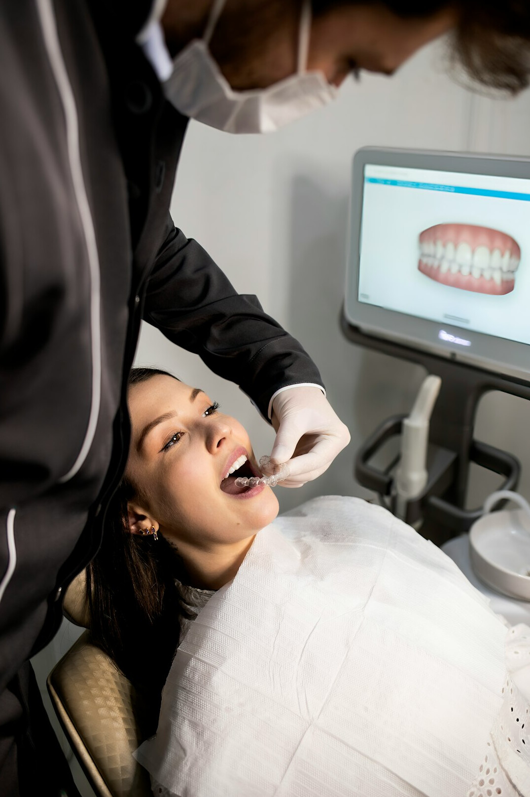 Dentist checking a patient's teeth in a modern dental clinic