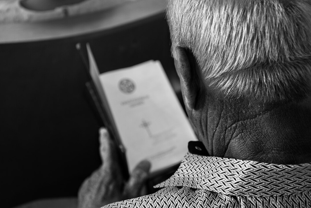 elderly person with insurance card